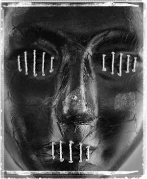 face with stitched up eyes
